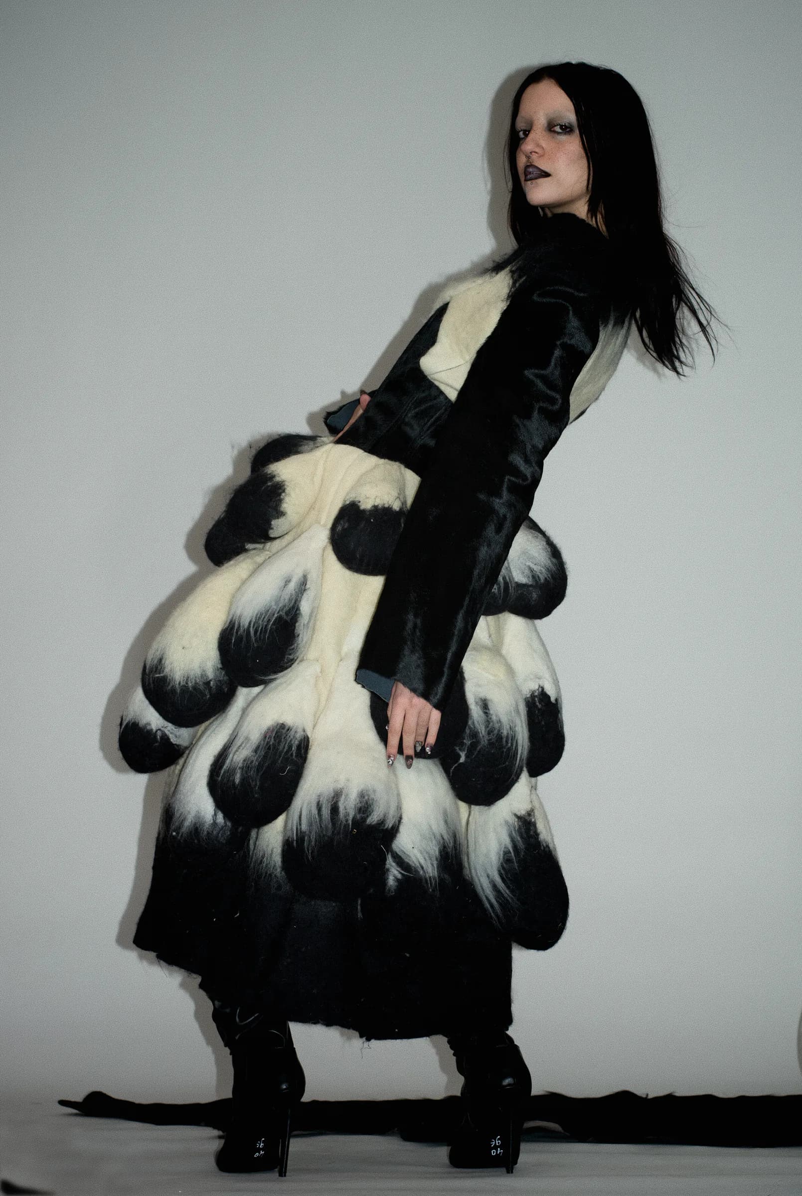KOZA corset worn with the sculptural coat
